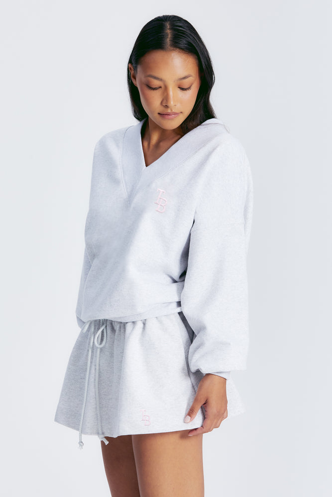 
                  
                    Load image into Gallery viewer, ASIA V NECK SWEATSHIRT LT HEATHER GREY/BLUSH
                  
                